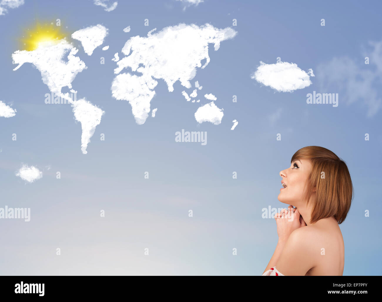 Young girl looking at world clouds and sun on blue sky Stock Photo - Alamy