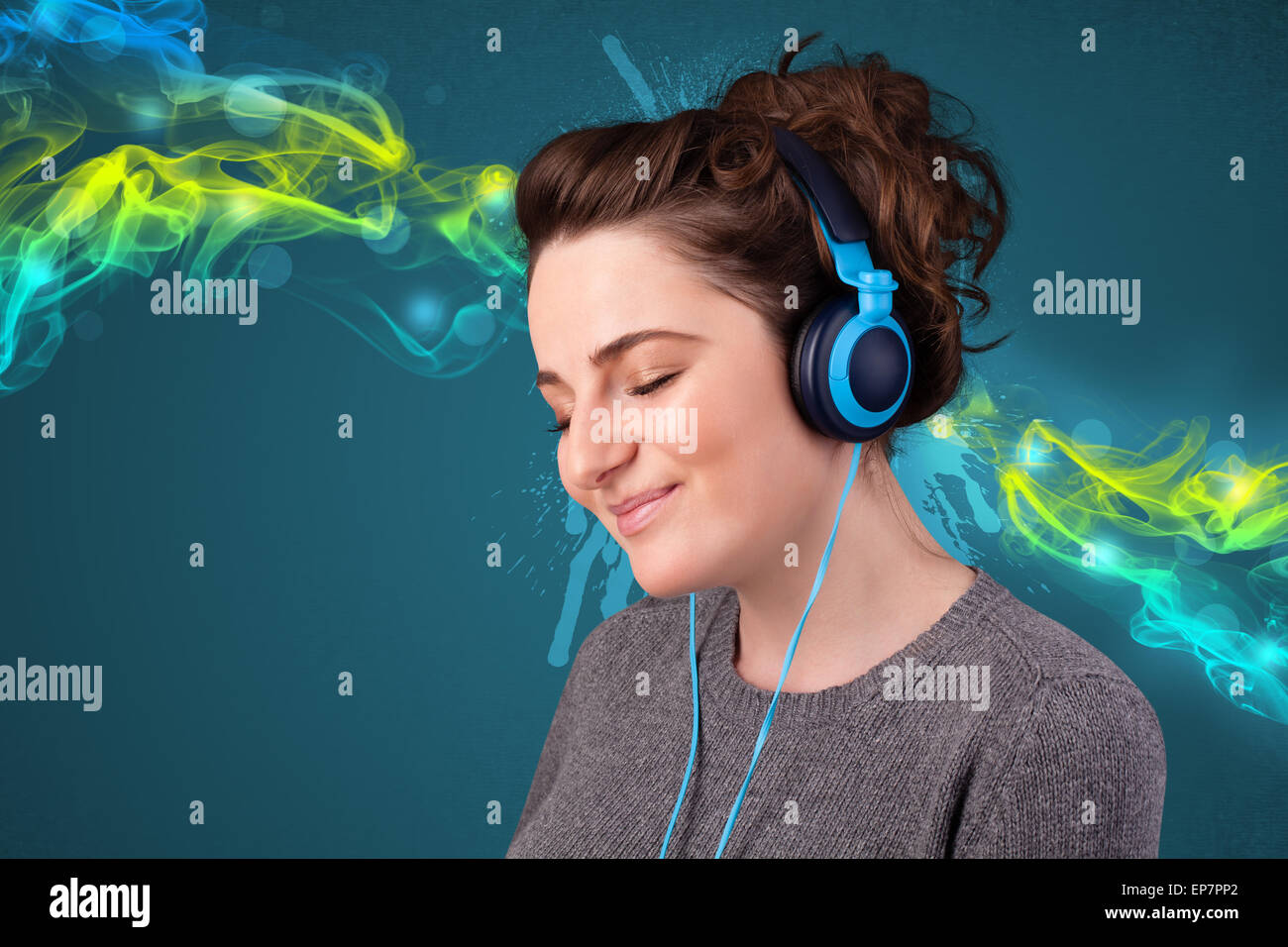 Young woman listening to music with headphones Stock Photo - Alamy