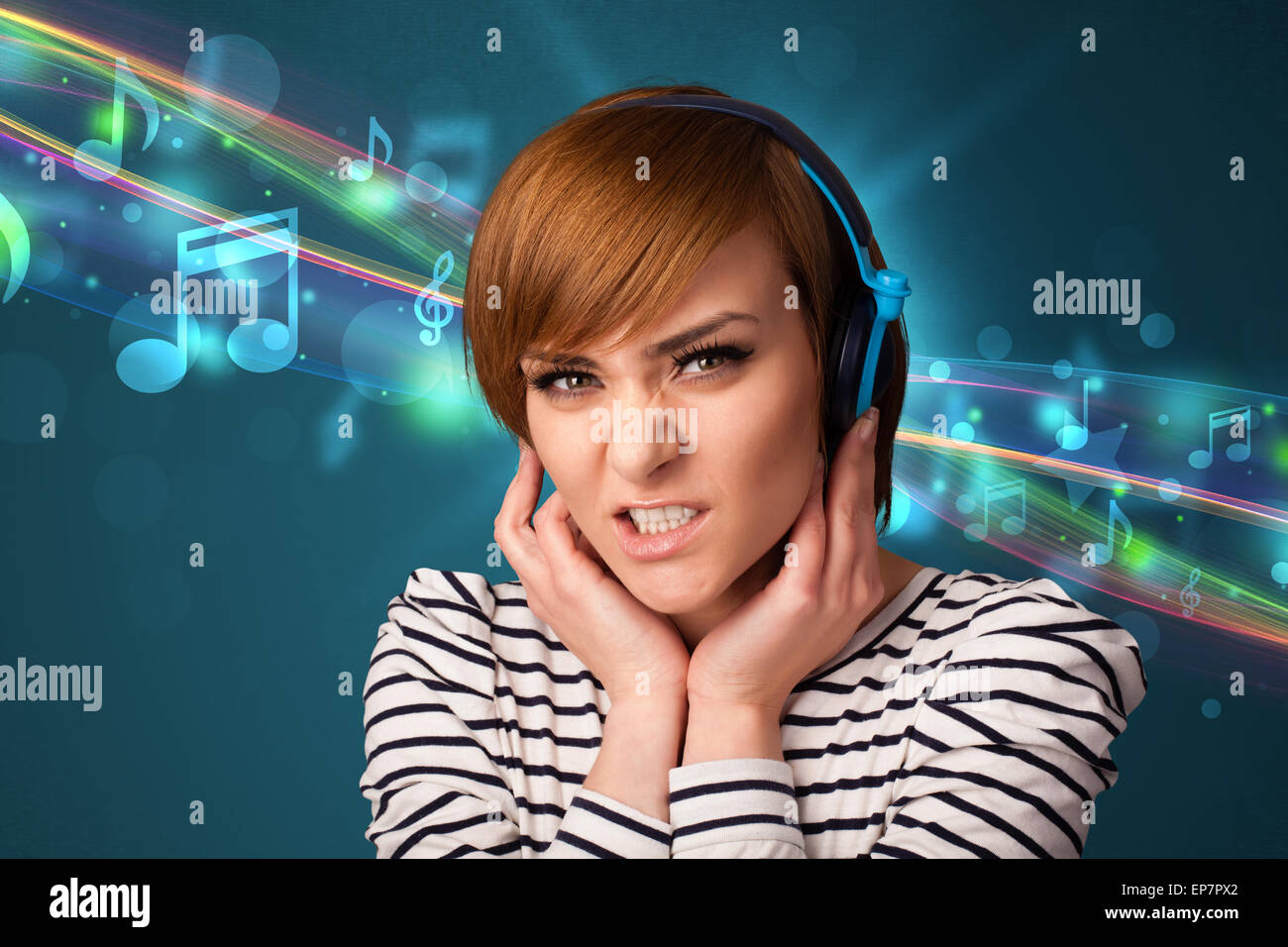 Young woman listening to music with headphones Stock Photo - Alamy