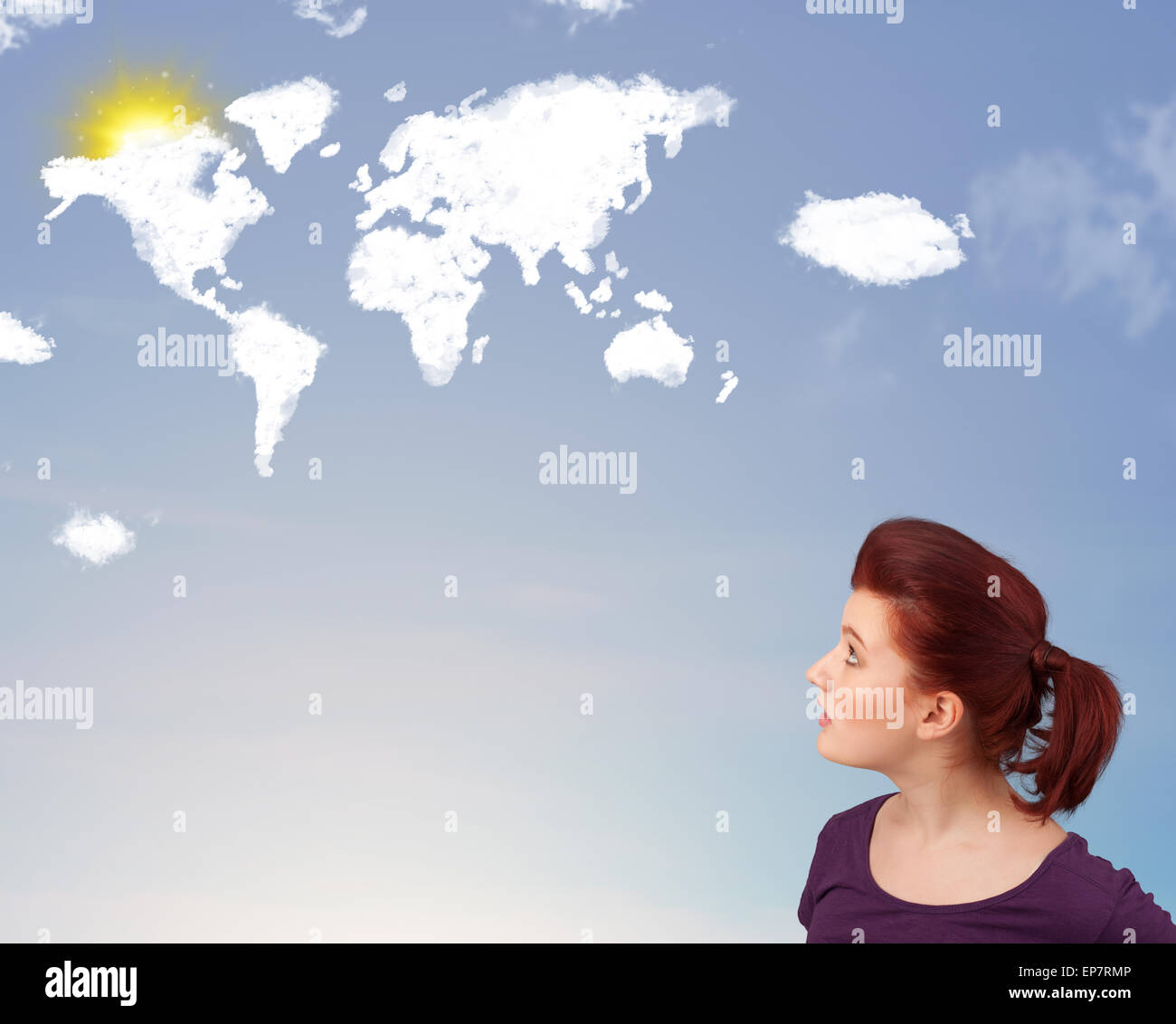 Young girl looking at world clouds and sun on blue sky Stock Photo - Alamy