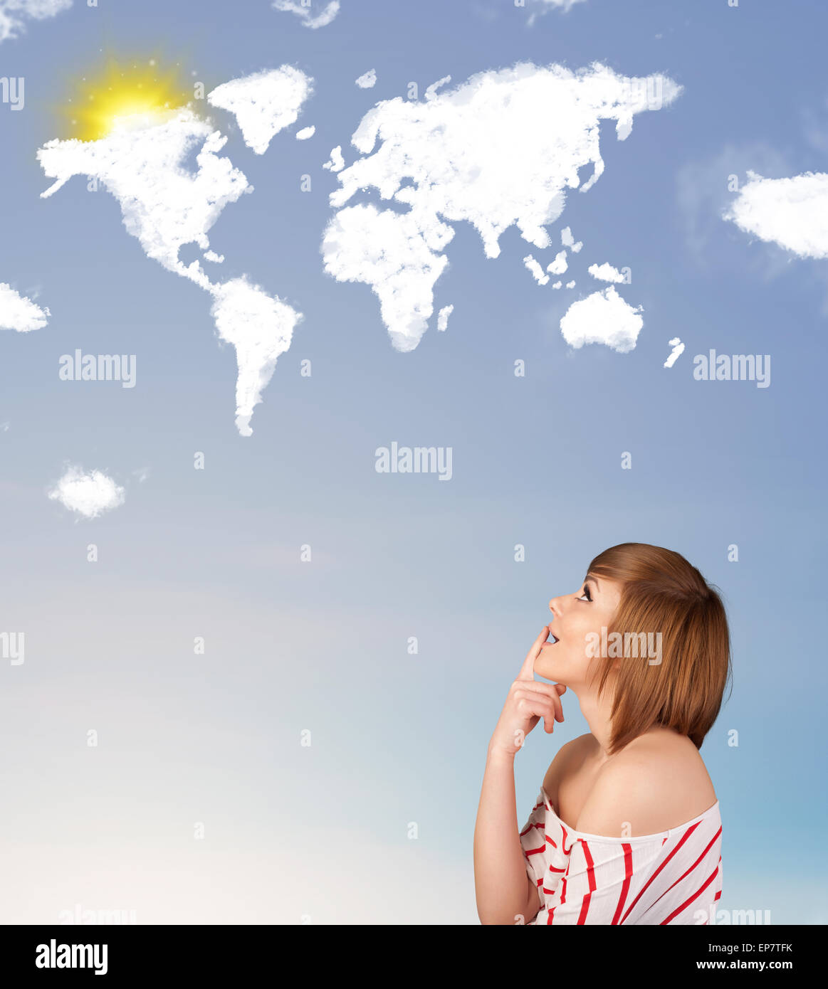 Young girl looking at world clouds and sun on blue sky Stock Photo - Alamy