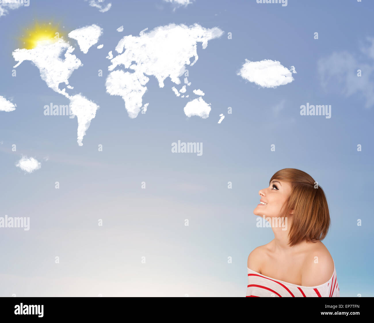 Young girl looking at world clouds and sun on blue sky Stock Photo - Alamy