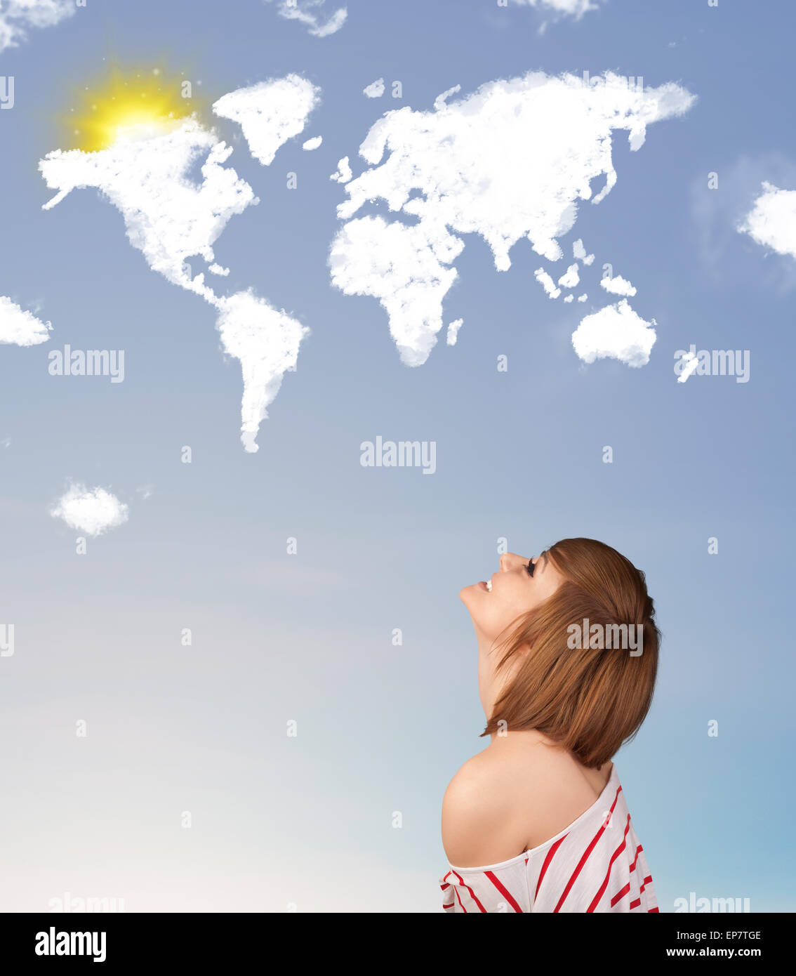 Young girl looking at world clouds and sun on blue sky Stock Photo - Alamy