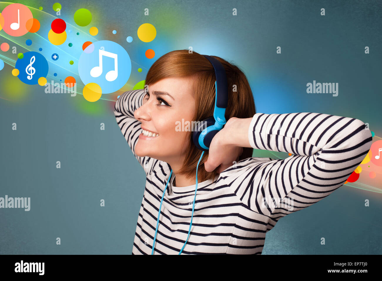 Young woman listening to music with headphones Stock Photo - Alamy