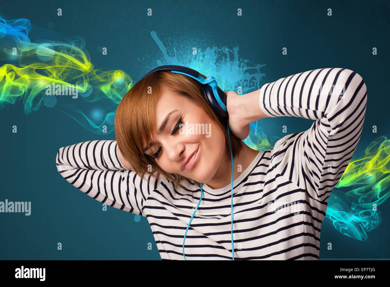 Young woman listening to music with headphones Stock Photo - Alamy