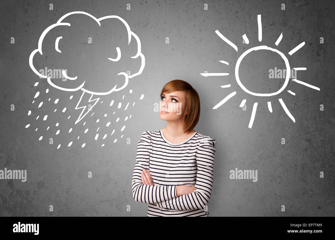 Woman standing between a sun and a rain drawing Stock Photo - Alamy