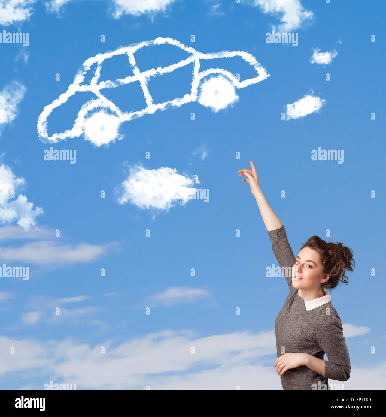 Young girl looking at car cloud on a blue sky Stock Photo - Alamy