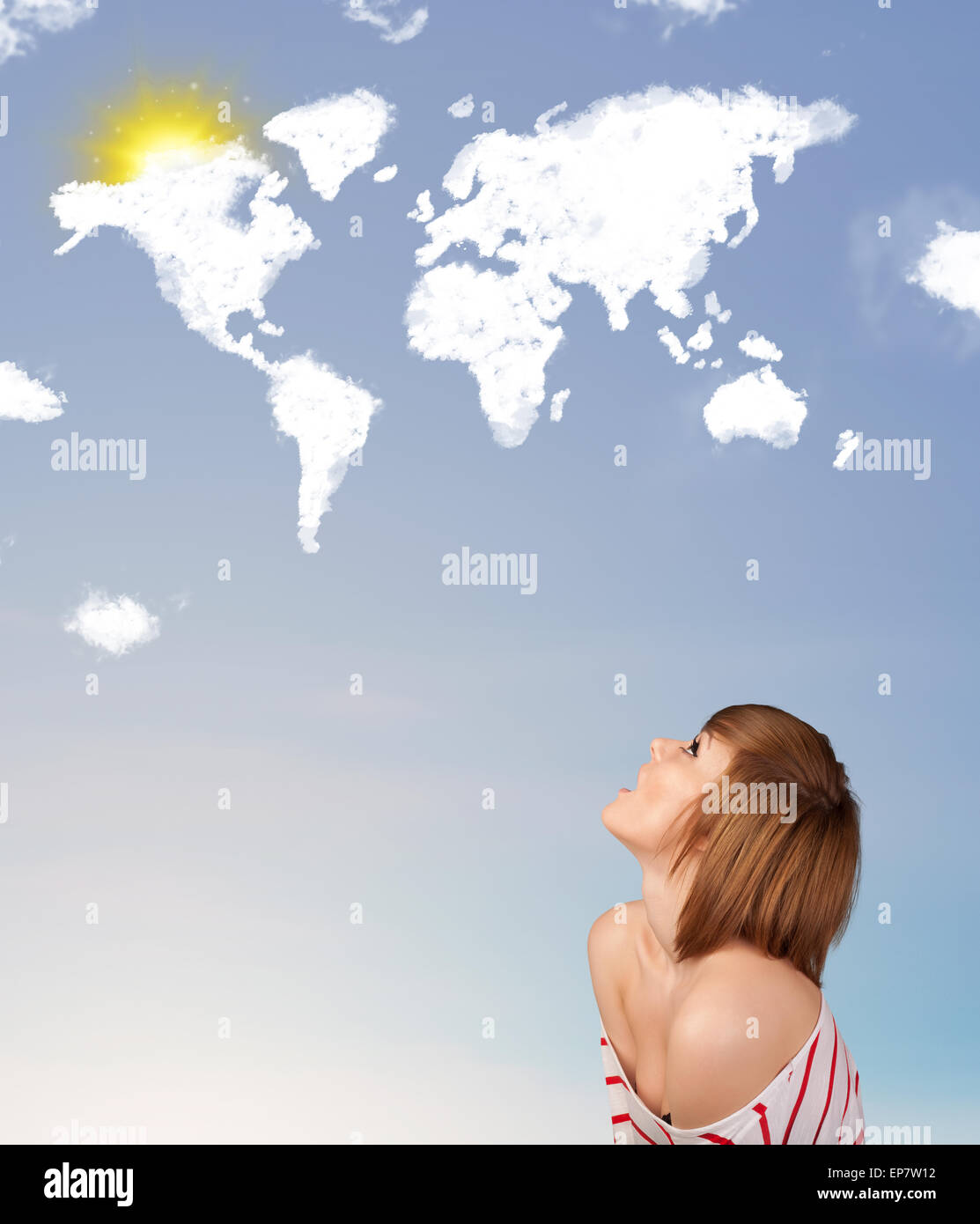 Young girl looking at world clouds and sun on blue sky Stock Photo - Alamy