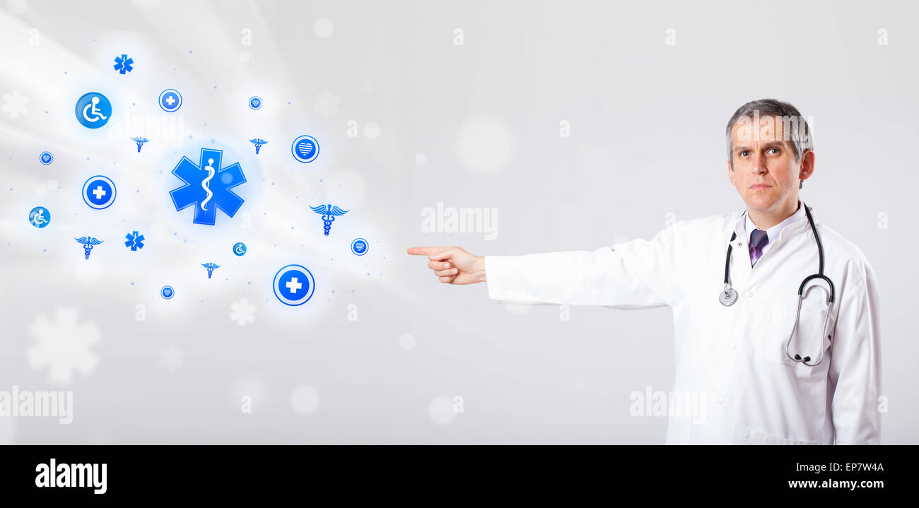 Doctor with blue medical icons Stock Photo - Alamy