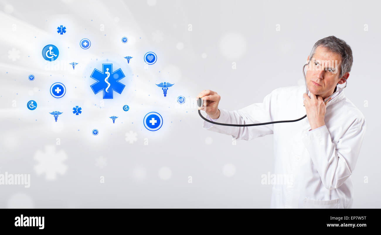 Doctor with blue medical icons Stock Photo - Alamy