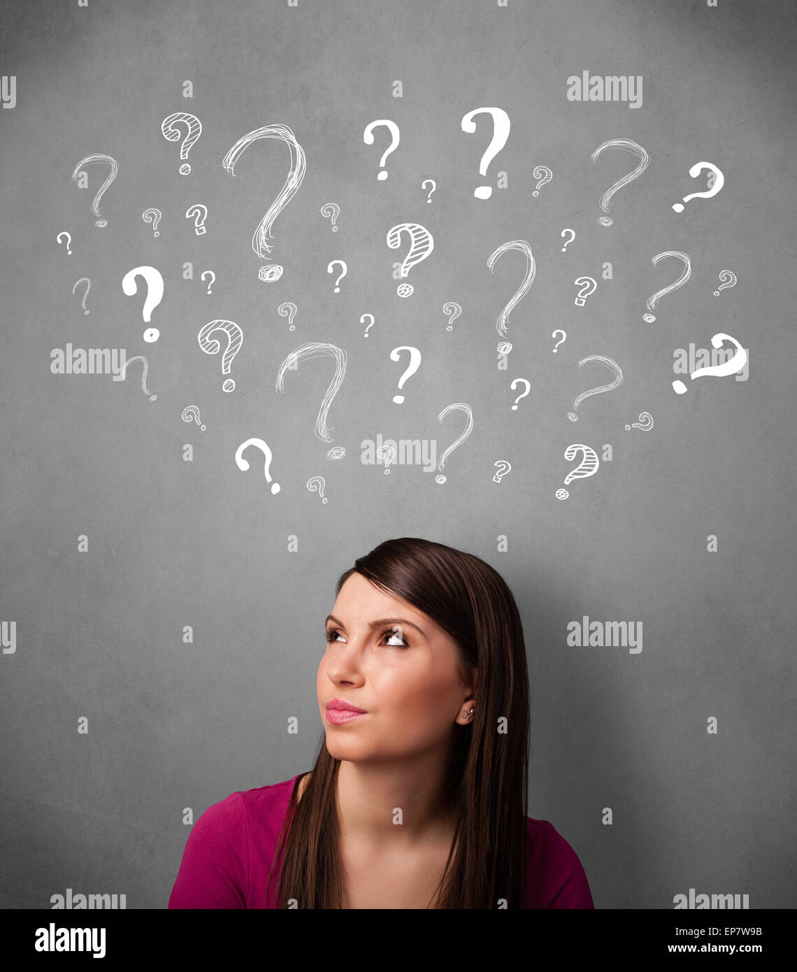 Young woman with question marks above her head Stock Photo - Alamy