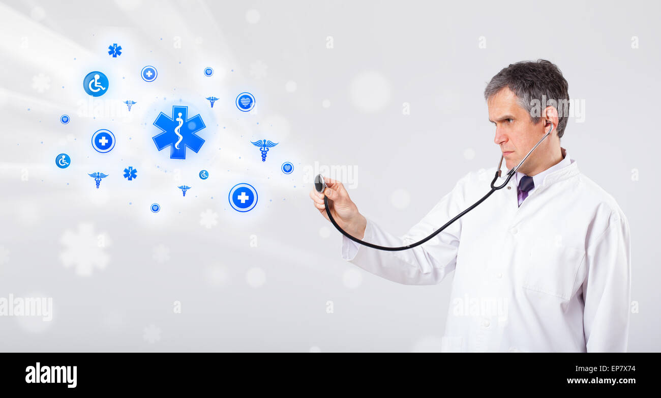 Doctor with blue medical icons Stock Photo - Alamy