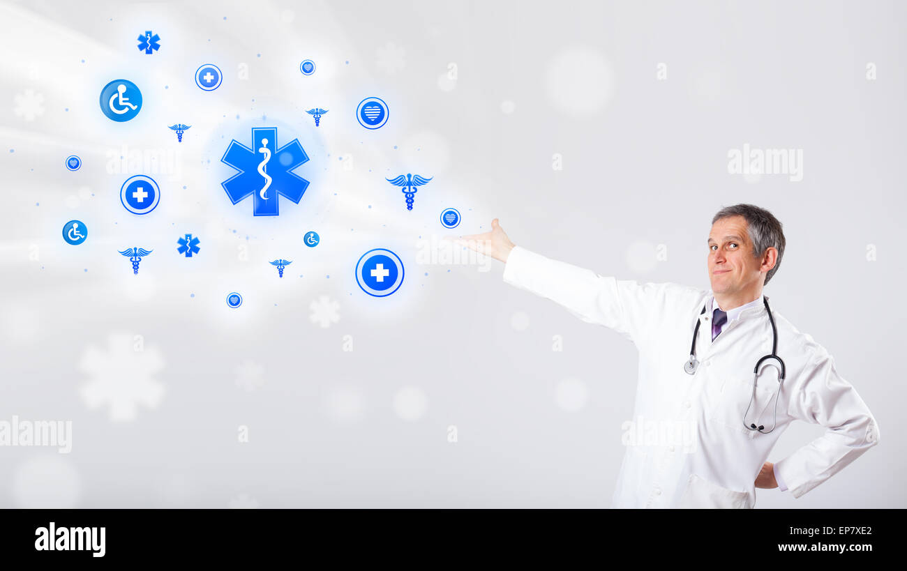 Doctor with blue medical icons Stock Photo - Alamy