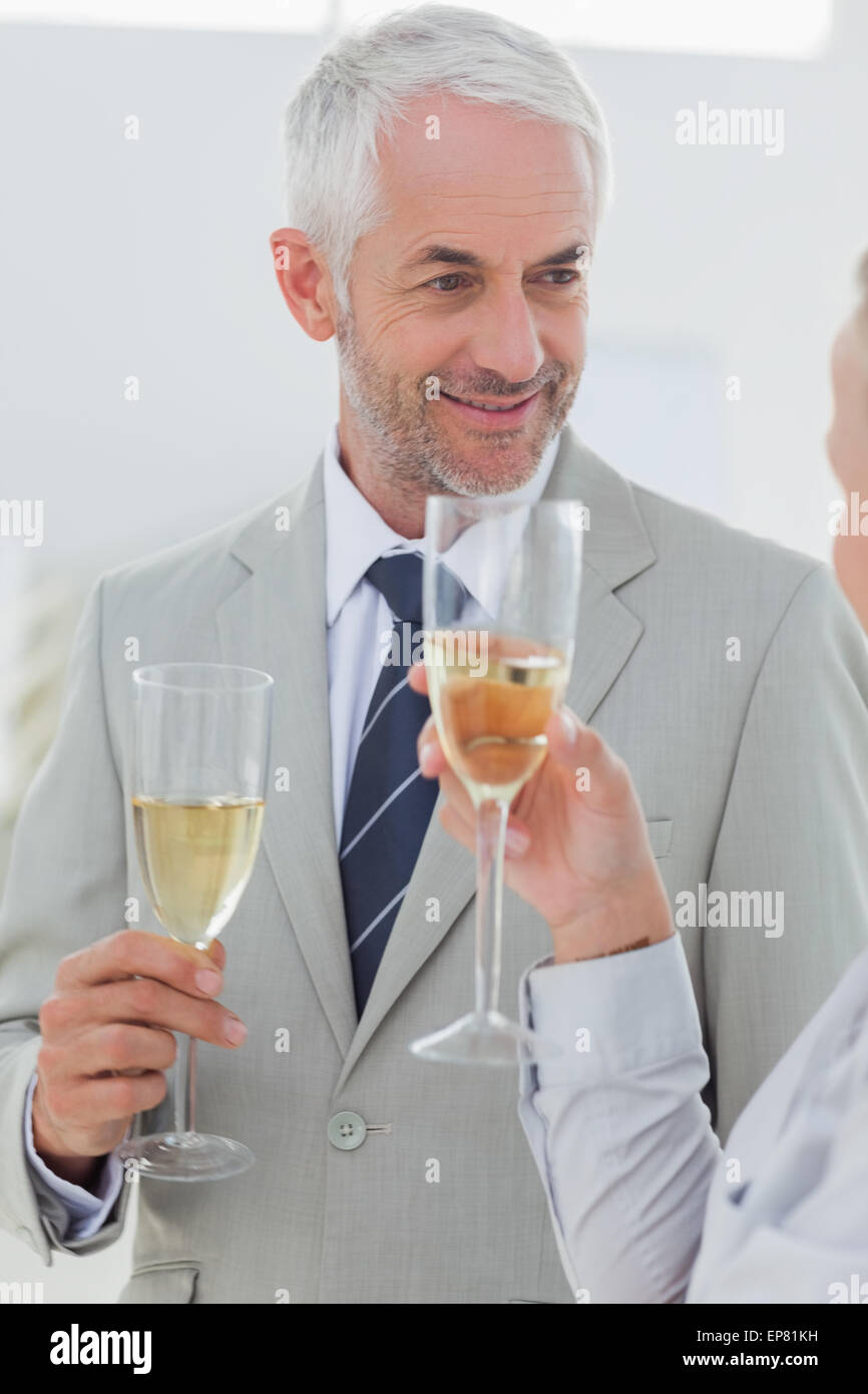 Smiling business partners toasting with champagne Stock Photo Alamy