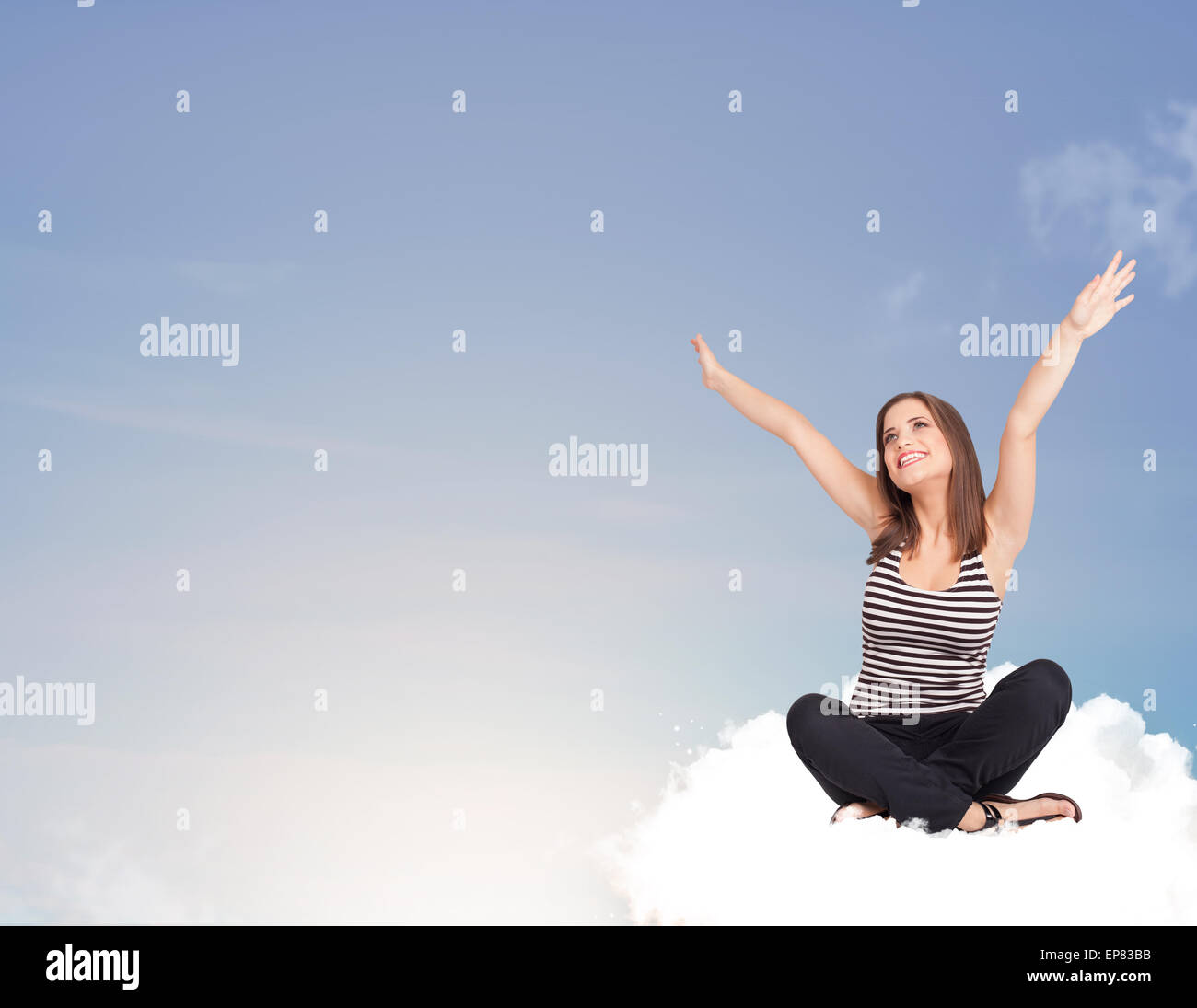 Young woman sitting on cloud with copy space Stock Photo - Alamy