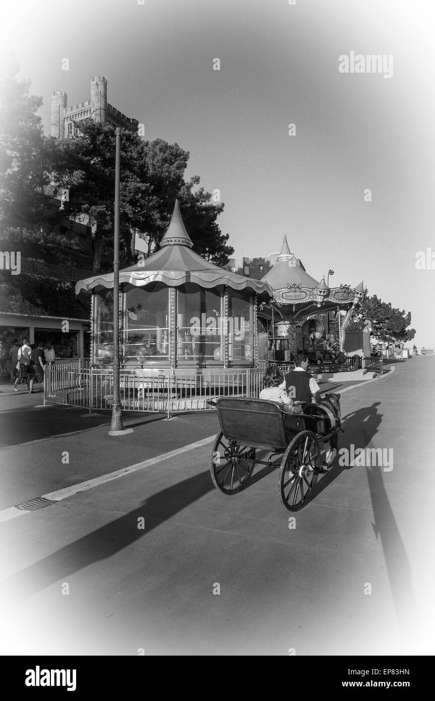 Girl in a horse carriage in the park amusement in the Monte Igueldo, San Sebastian, Basque Country, Spain. Europe, Stock Photo