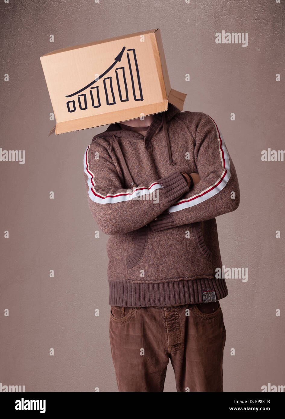 Young man gesturing with a cardboard box on his head with diagram Stock ...