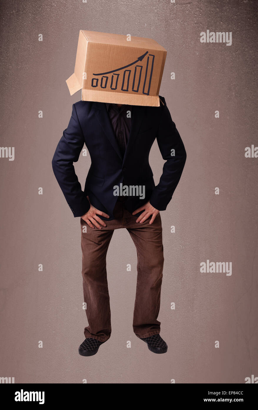 Young man gesturing with a cardboard box on his head with diagram Stock ...