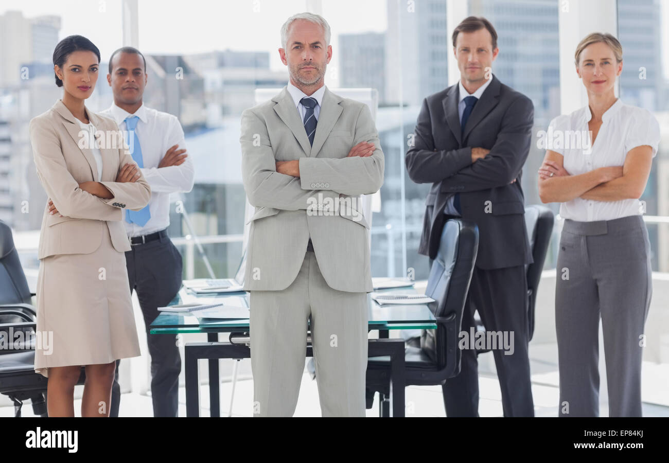 Serious team of business people posing together Stock Photo - Alamy