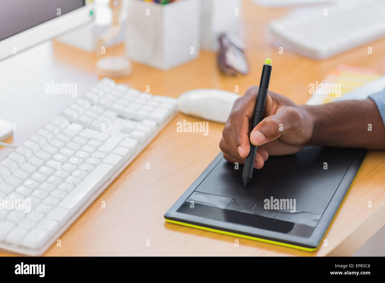 Designer Using Tablet Close up of a graphic designer using graphics tablet Stock Photo - Alamy