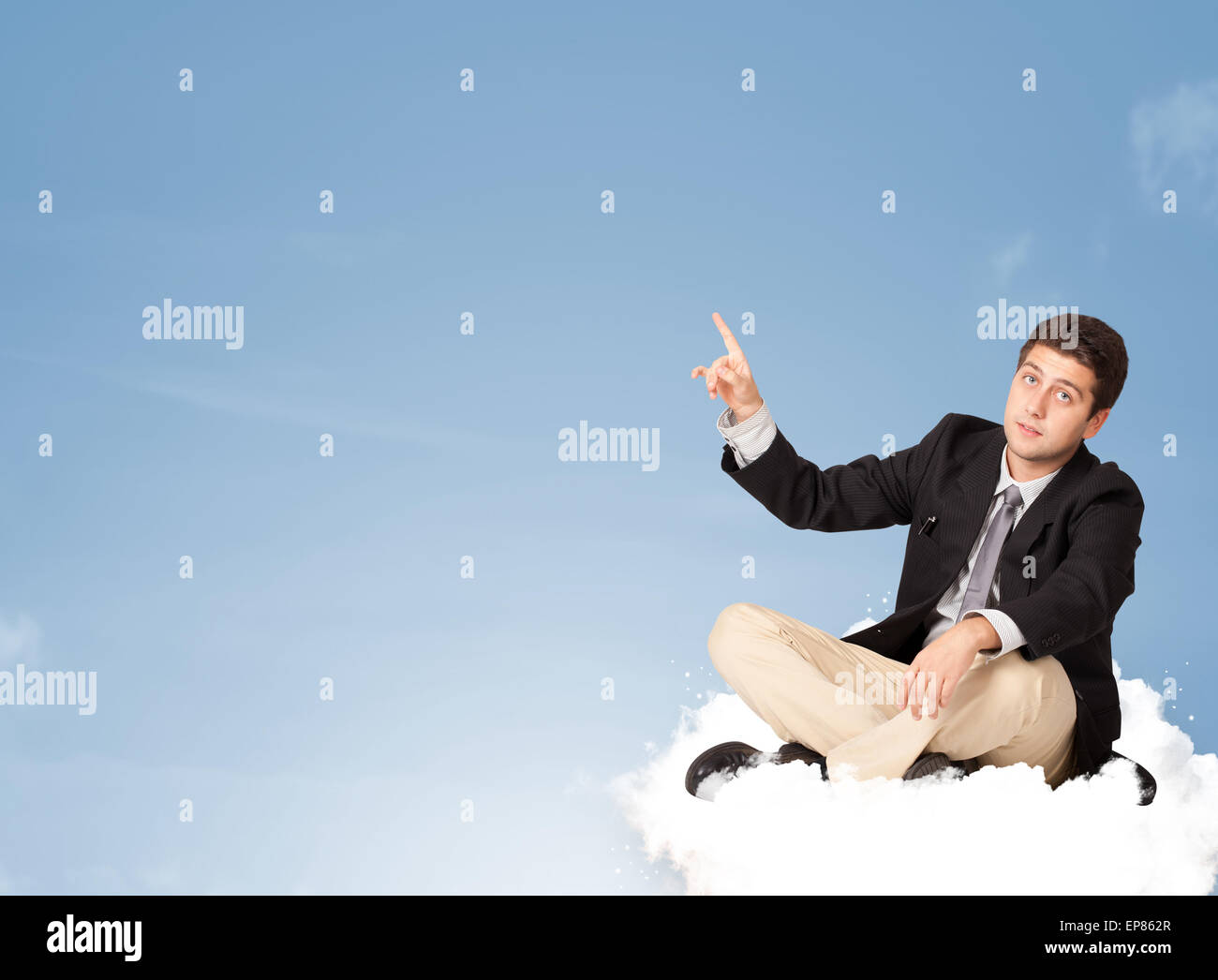 Attractive businessman sitting on cloud with copy space Stock Photo - Alamy