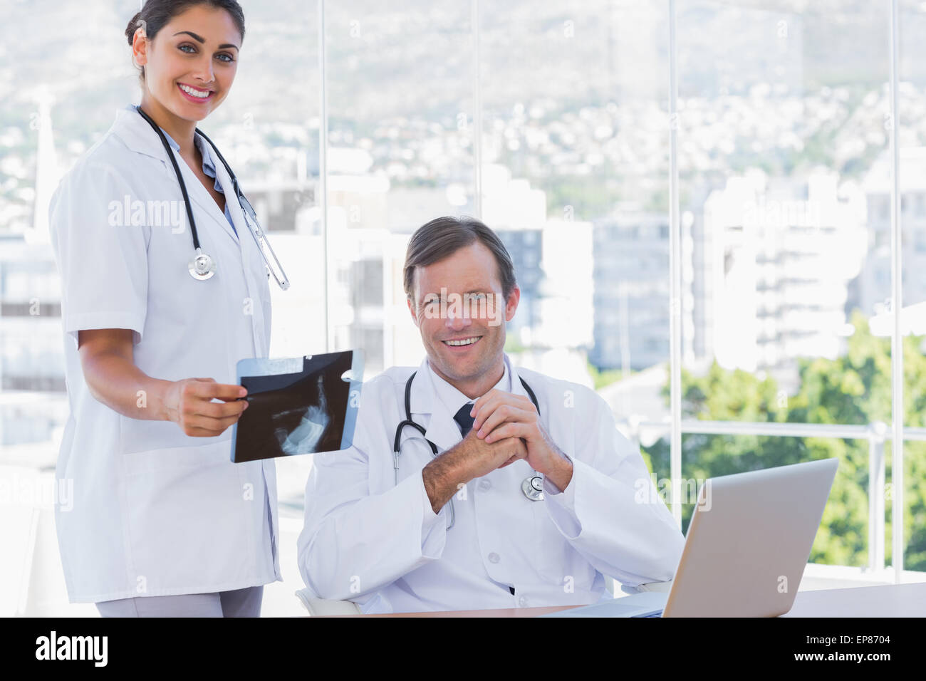 Group happy doctors holding hi-res stock photography and images - Alamy