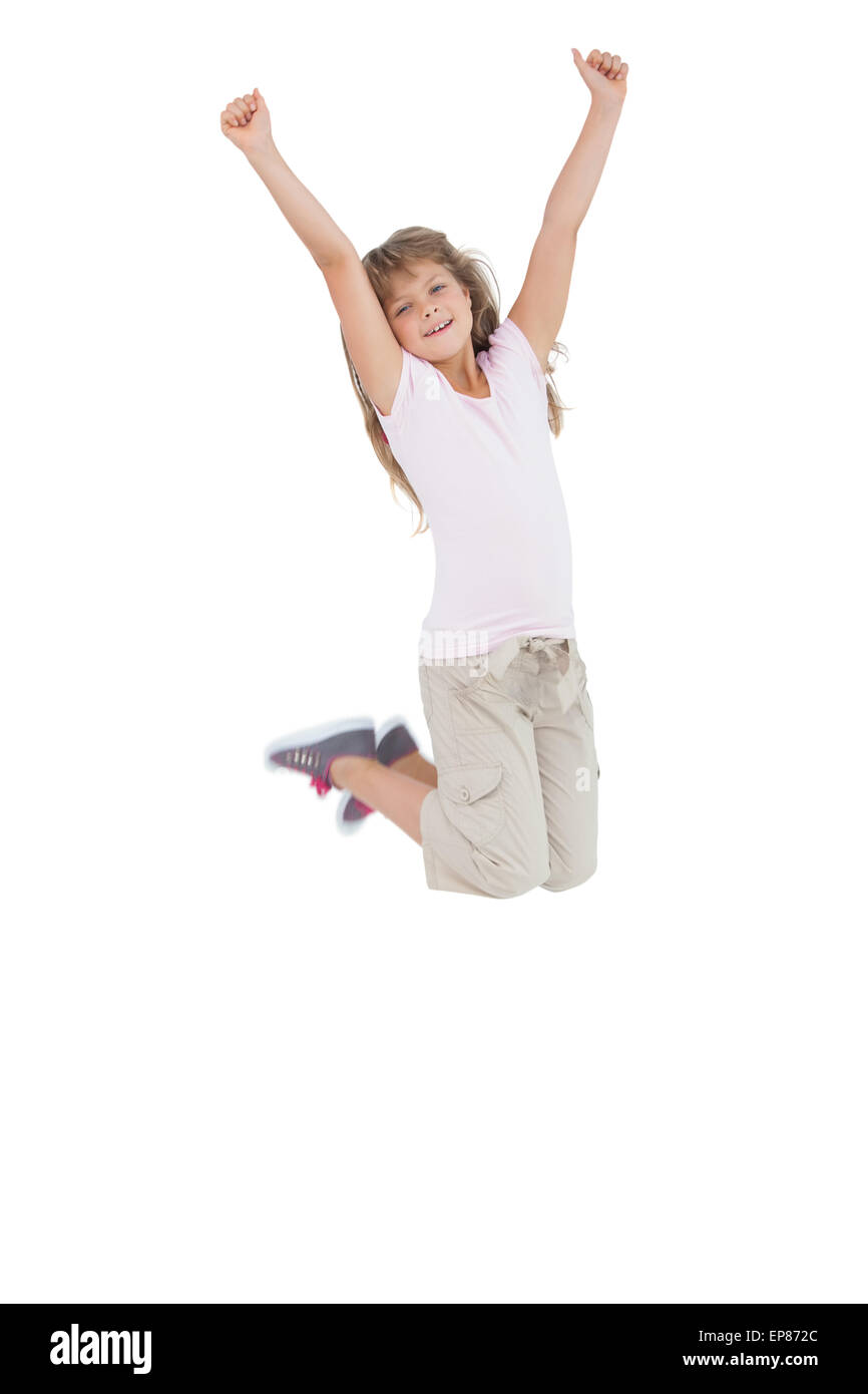 Little girl jumping and putting her hands up Stock Photo Alamy