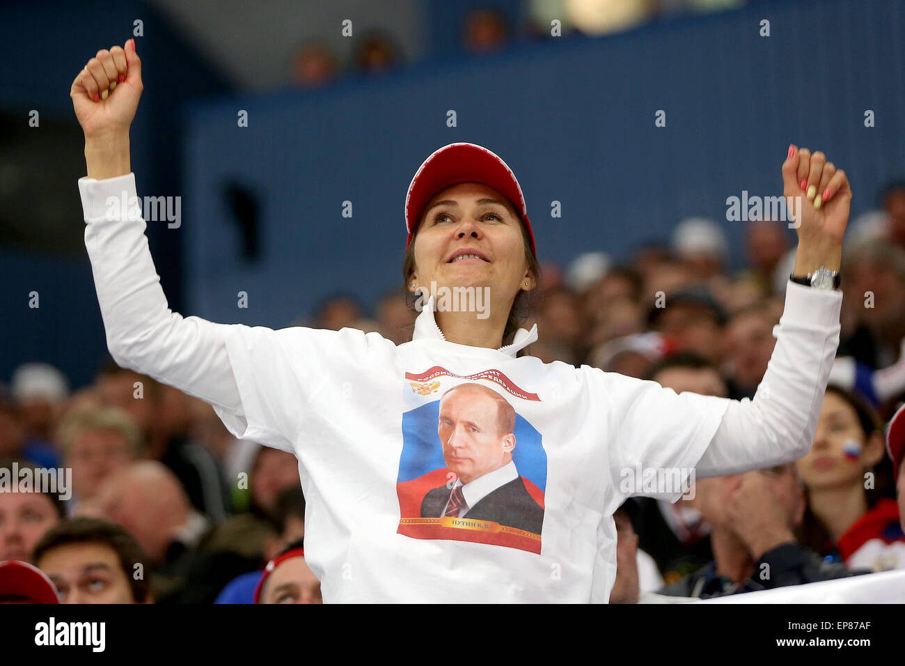 Ostrava, Czech Republic. 14th May, 2015. Russian female fan in T-shirt with Vladimir Putin on it cheers up during the Hockey World Championships quarterfinal match Sweden vs Russia in Ostrava, Czech Republic, May 14, 2015. Credit:  Petr Sznapka/CTK Photo/Alamy Live News Stock Photo