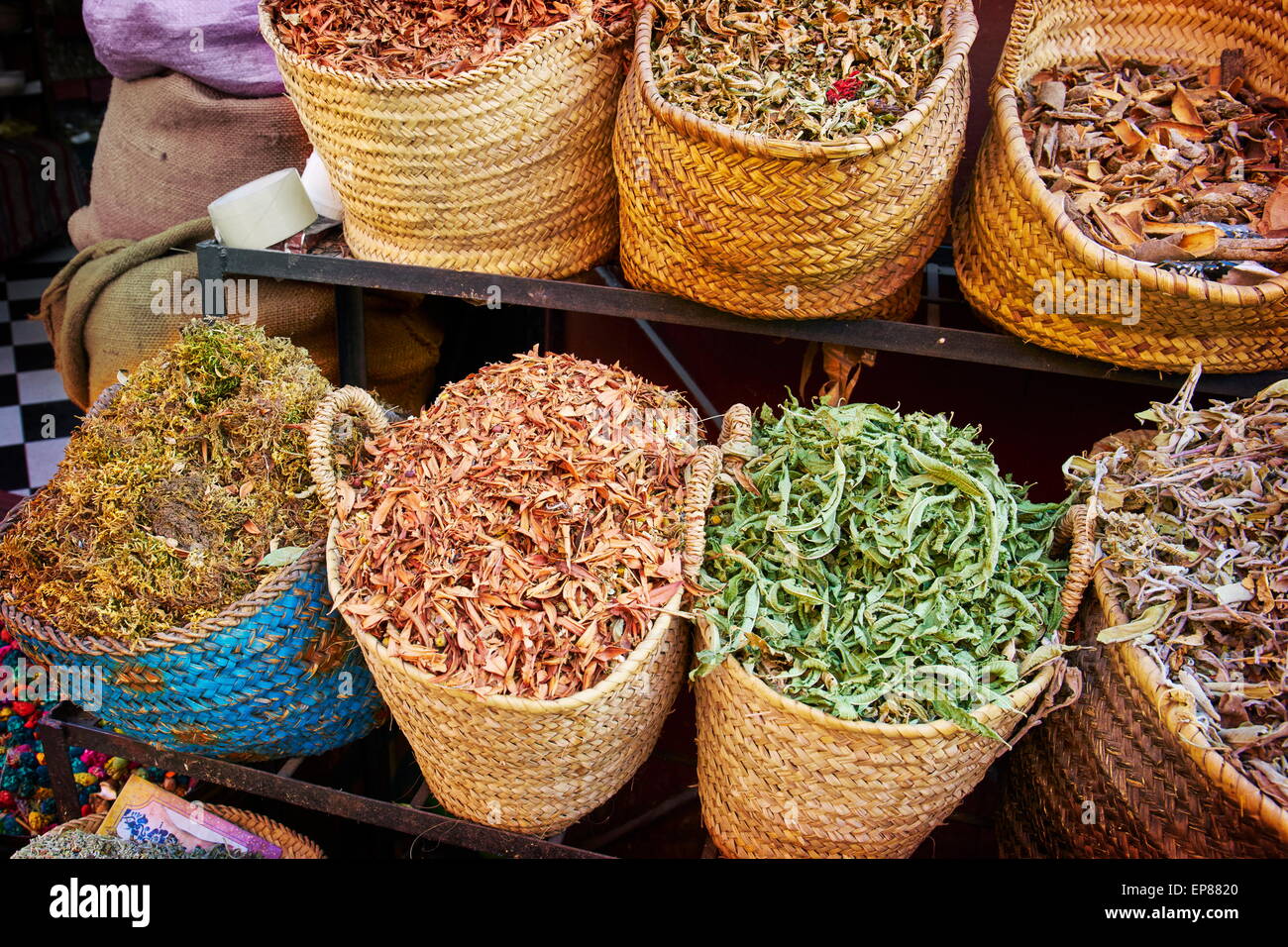 Baskets of dried spices, buds and herbs in the souk. Morocco Stock Photo