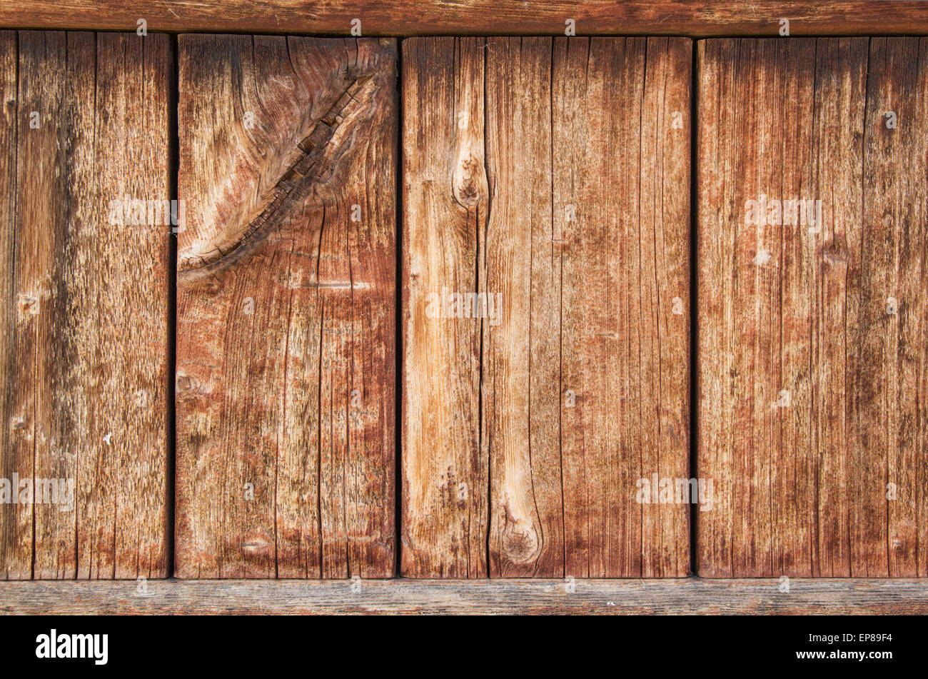 old weathered wood panel with cracking wood grain and fading stain Stock Photo