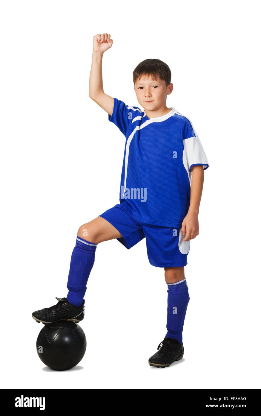 A young boy football player in blue uniform isolated on white Stock Photo
