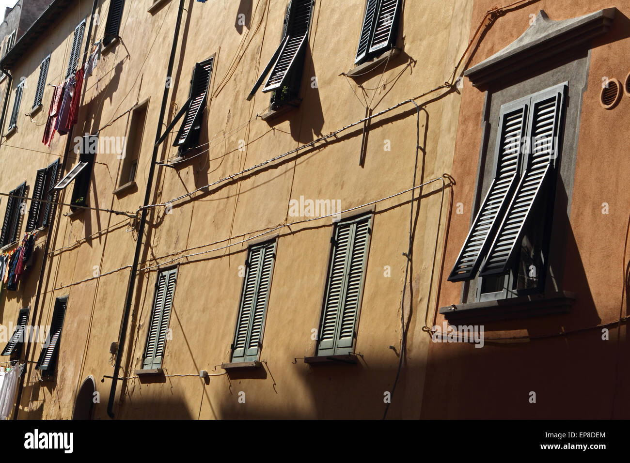 Building facade with windows and shutters Stock Photo - Alamy