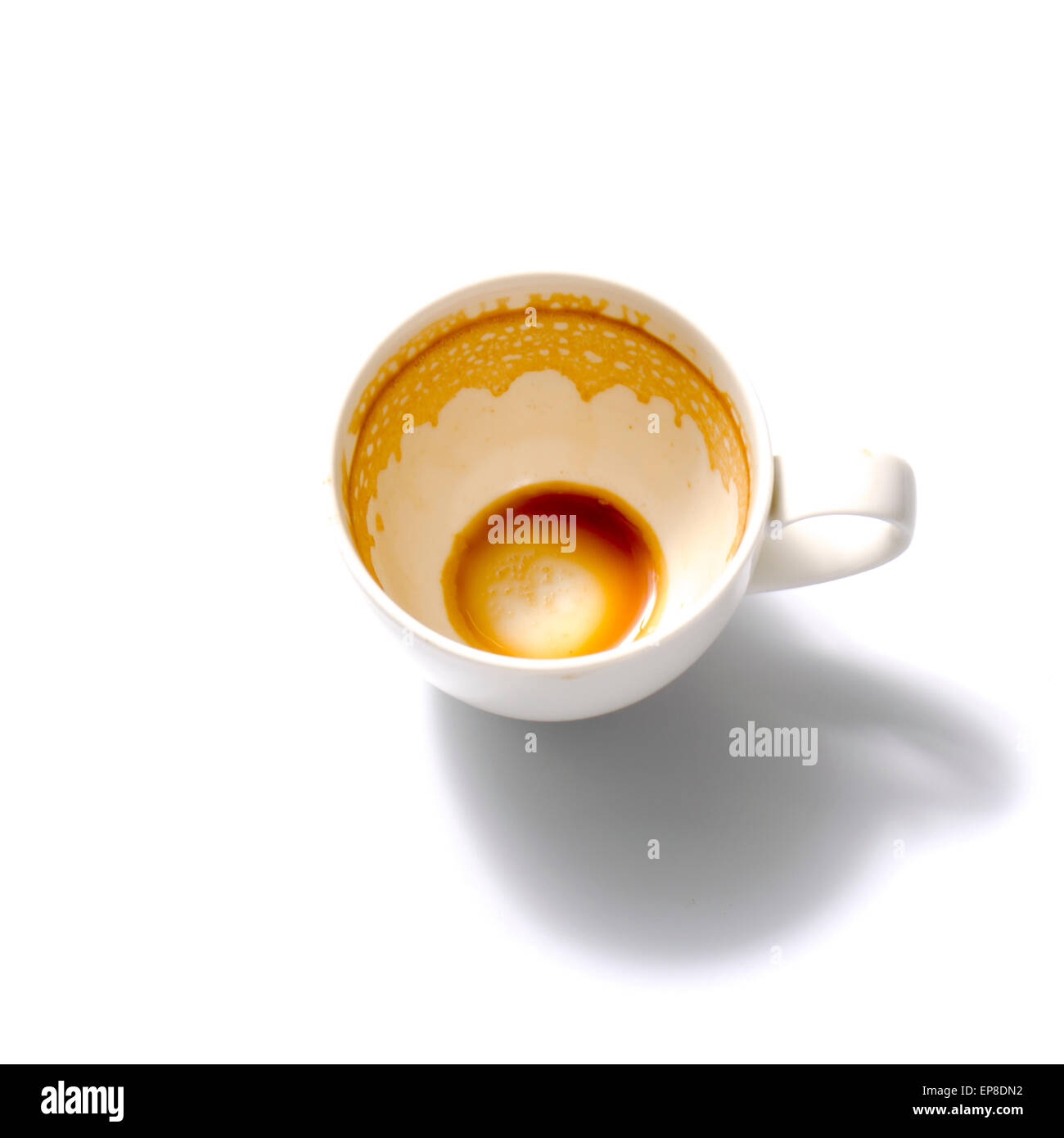 top view empty and dirty cup of coffee on a white background Stock