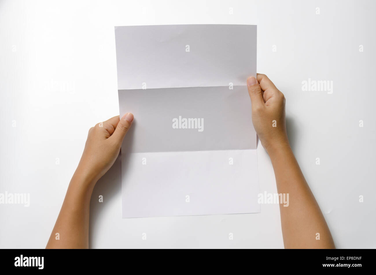 woman two hands holding blank paper a4 size on a white background Stock ...