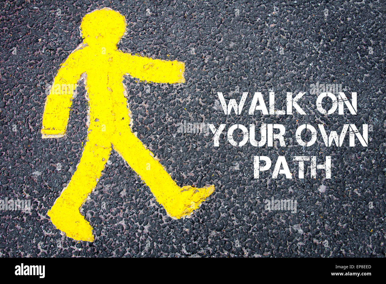 Yellow pedestrian figure on the road walking towards Walk On Your Own