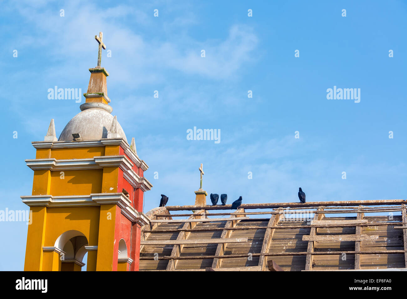 Old abandoned church in the Barranco neighborhood with vultures on it in Lima, Peru Stock Photo