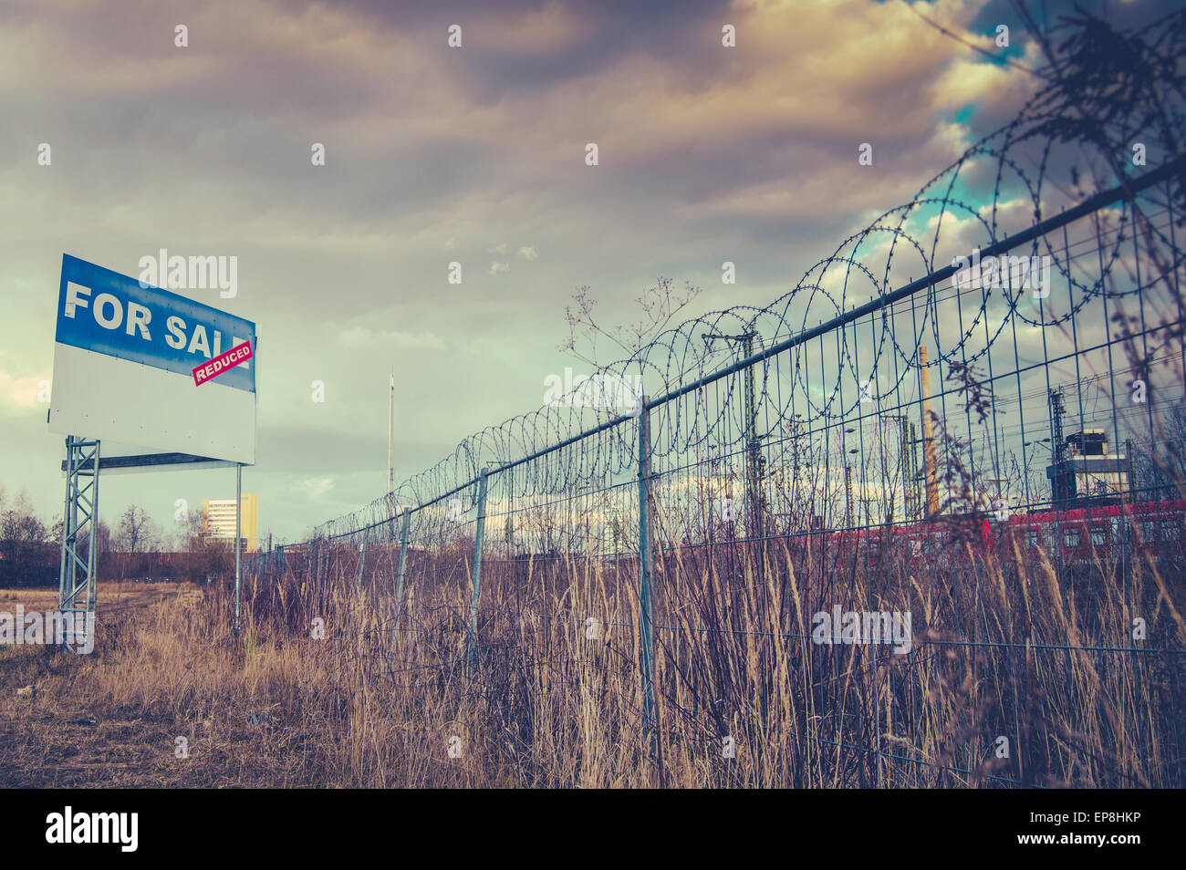 A For Sale Billboard Sign In An Urban Industrial Wasteland Or Vacant Lot Stock Photo