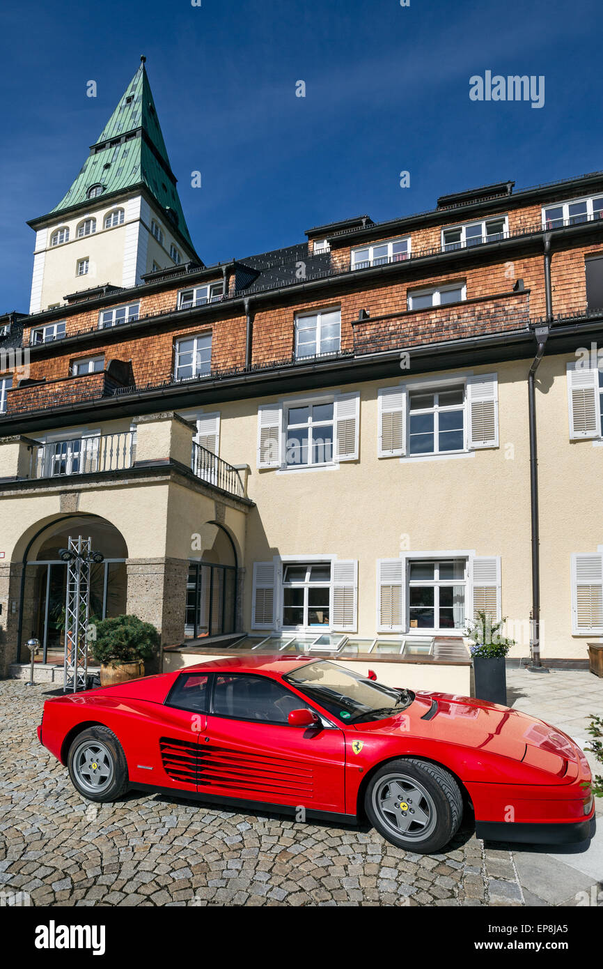 Ferrari in front of Schloss Elmau castle hotel, Klais, Werdenfelser Land, Upper Bavaria, Bavaria, Germany Stock Photo