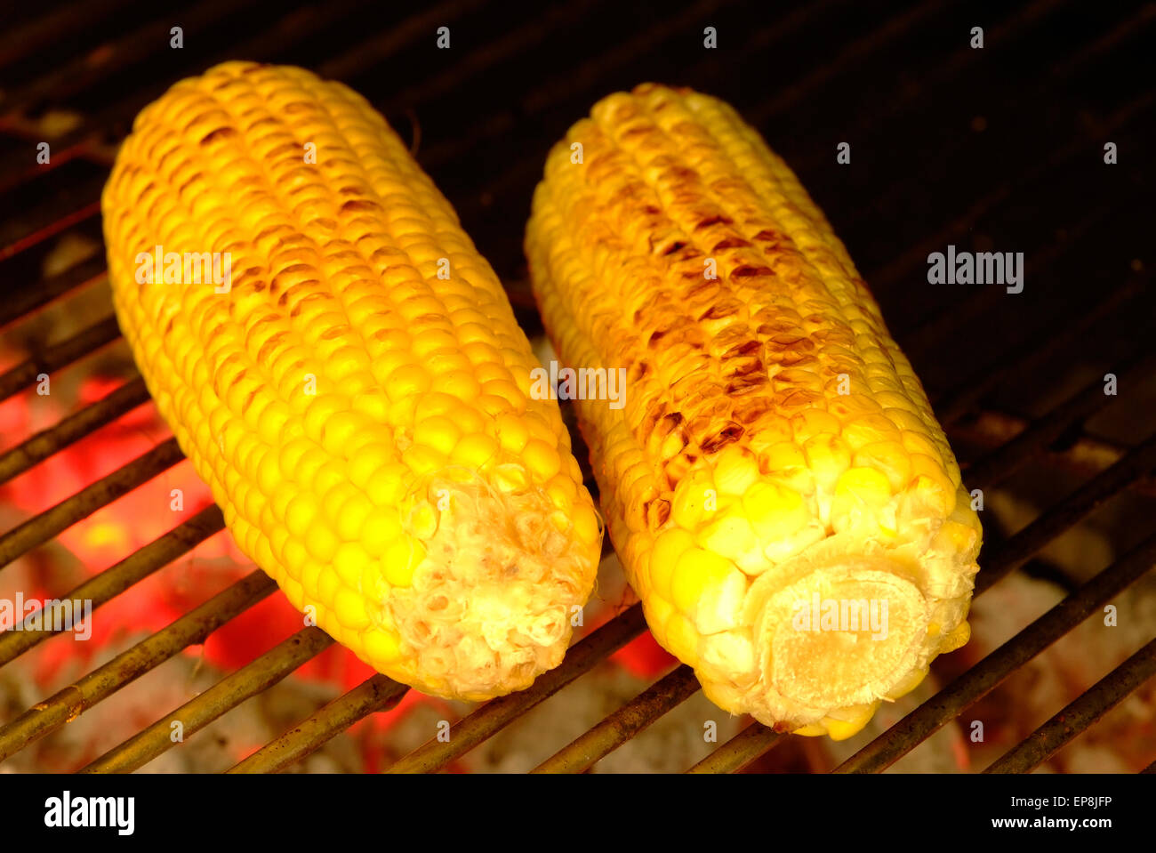 Mielies or corn on the cob is often cooked on open fire in South Africa Stock Photo