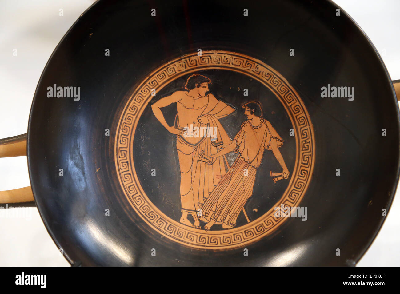 Kylix (drinking cup). Greek, Attic, red-figure, ca 490 B.C. Attributed to Makron. Youth and girl dancing with castanets. Stock Photo