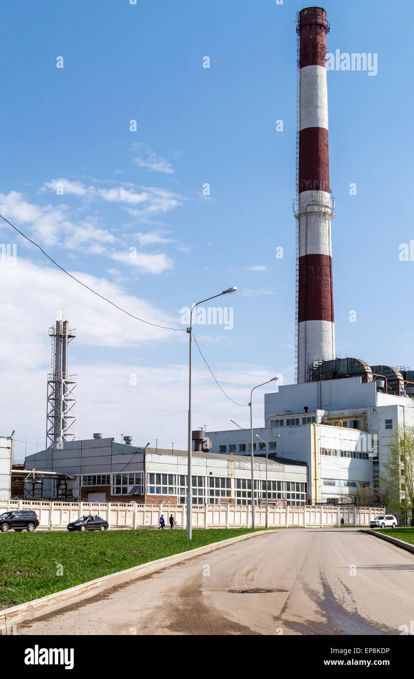 Work building with a large red and white chimney Stock Photo