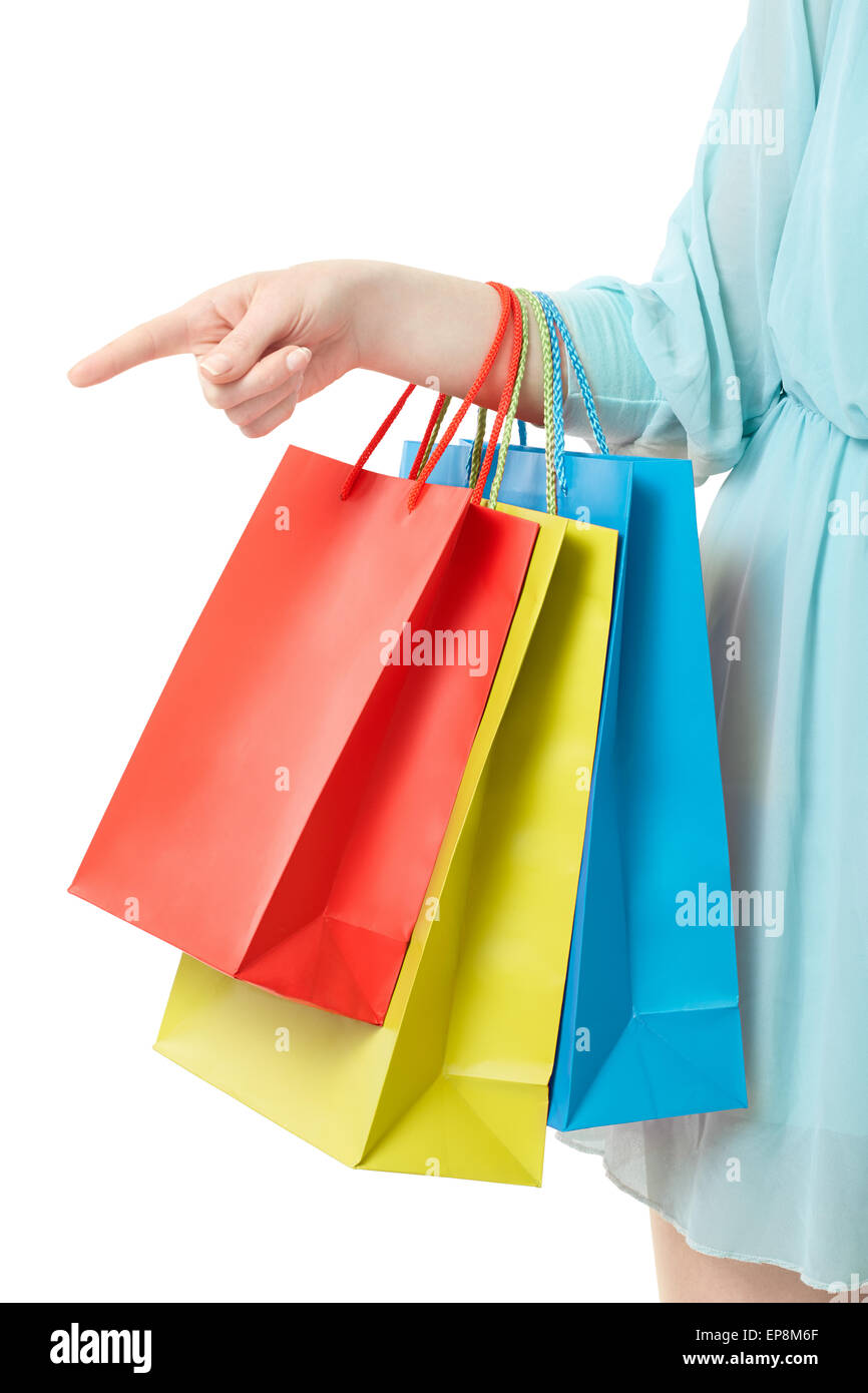 Woman hand holding shopping bags, pointing at on white Stock Photo