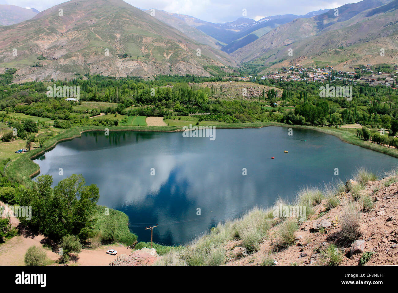 spring in a blue lake surrounded by mountains, Evan lake, Qazvin, Iran Stock Photo