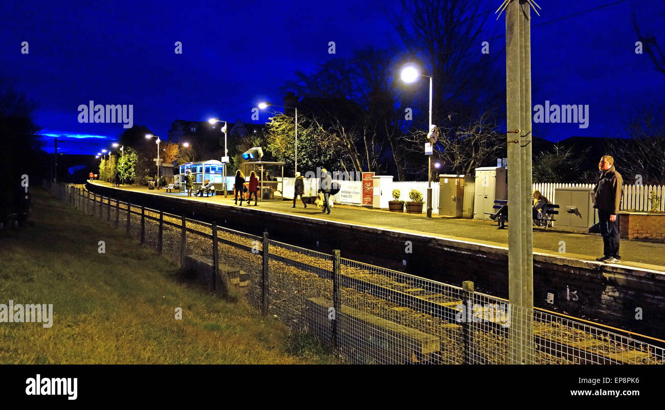 Pasengers waiting for train at night, North Berwick Stock Photo
