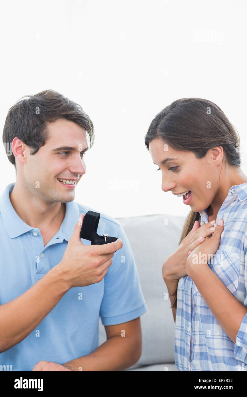 Handsome man offering an engagement ring to his girlfriend Stock Photo