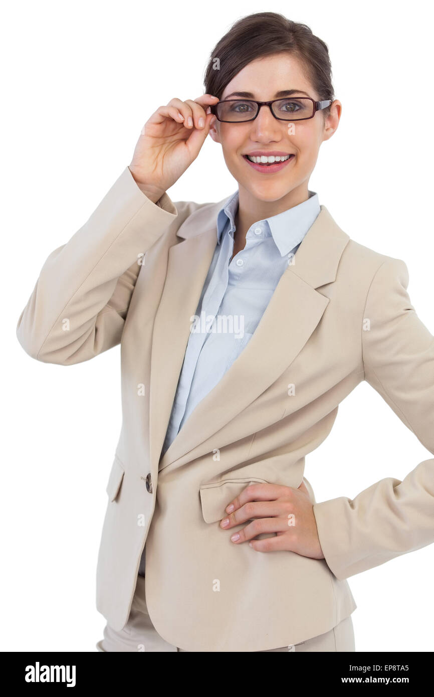 Smiling young businesswoman holding her glasses Stock Photo - Alamy