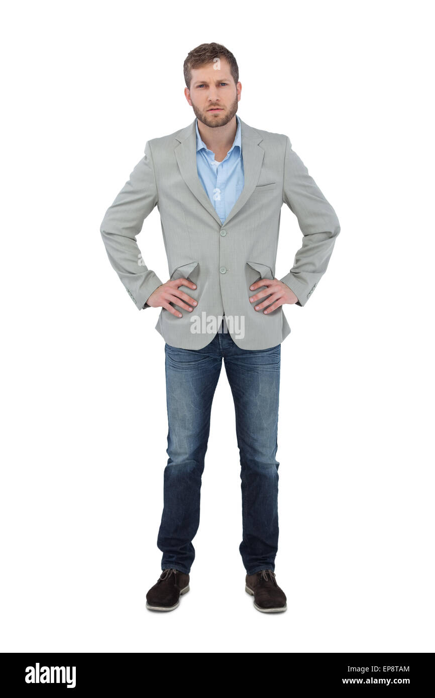 Serious trendy man posing with hands on hips Stock Photo - Alamy