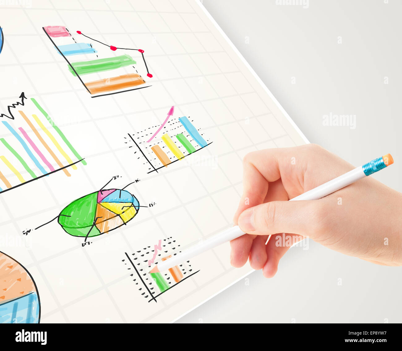 Business person drawing colorful graphs and icons on paper Stock Photo ...