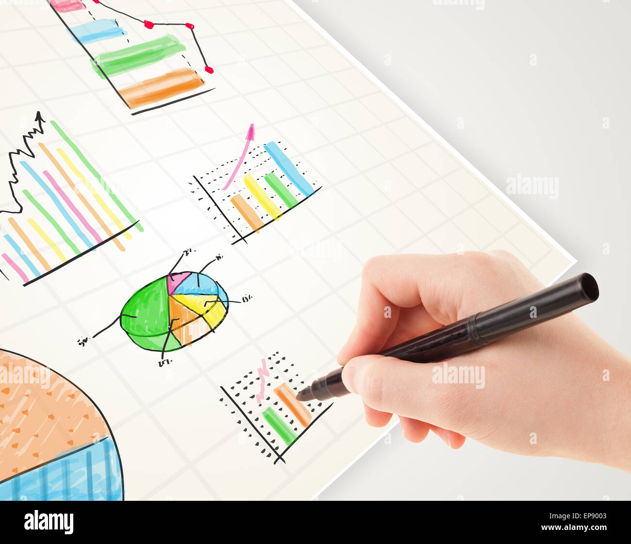 Business person drawing colorful graphs and icons on paper Stock Photo ...