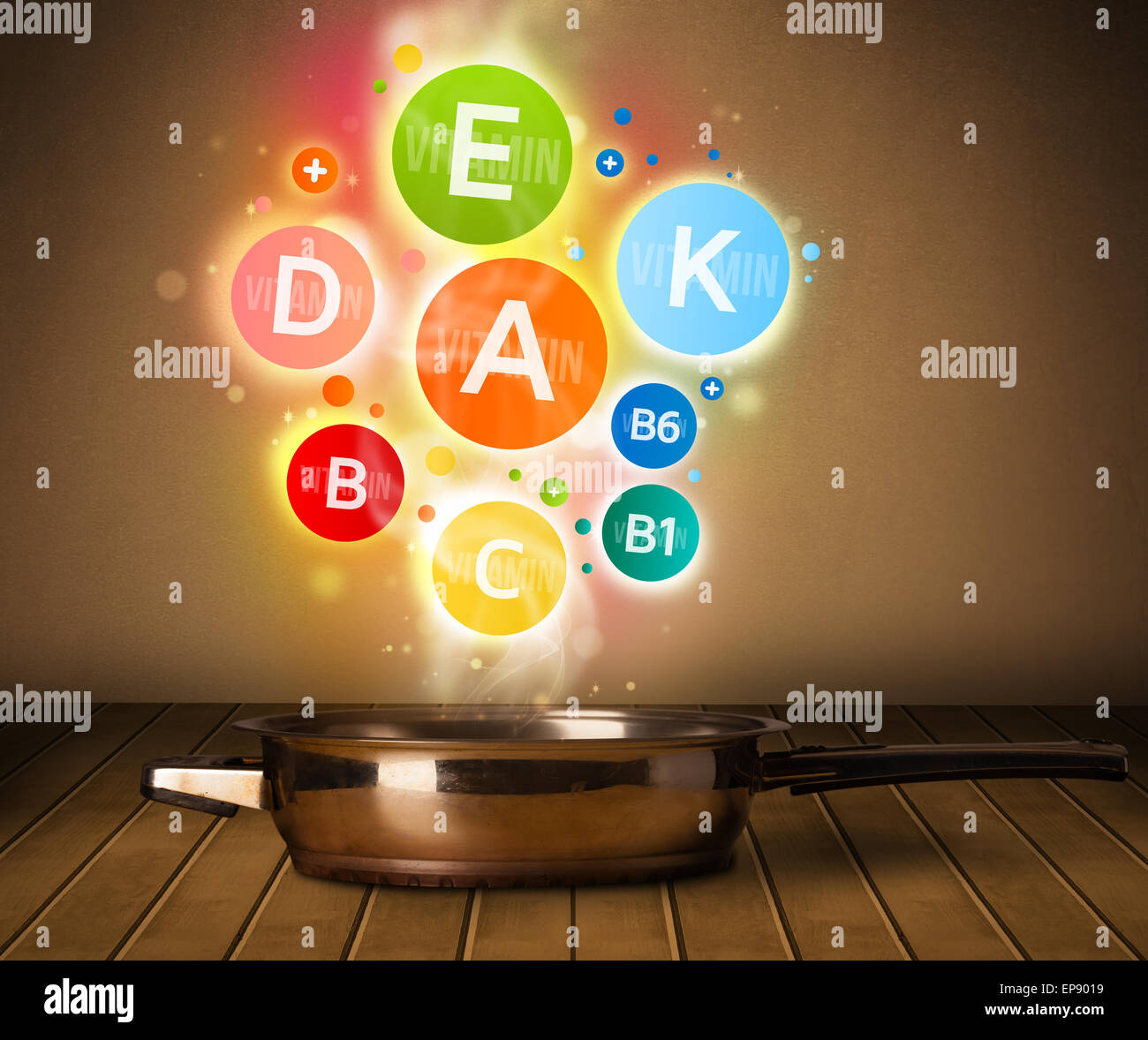 Colorful vitamins coming out from cooking pot Stock Photo Alamy